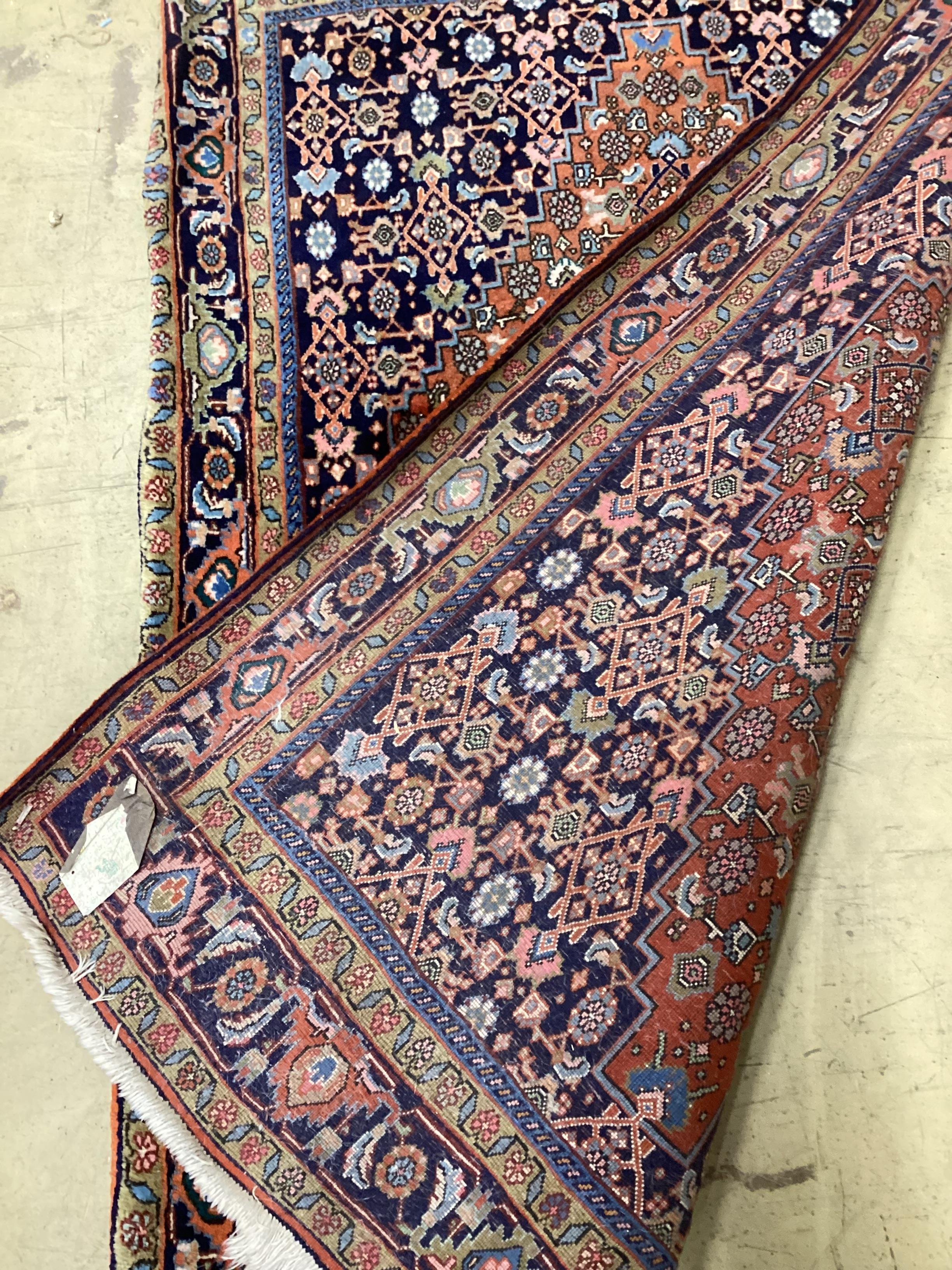 A Qashqai blue ground rug, 166 x 114cm